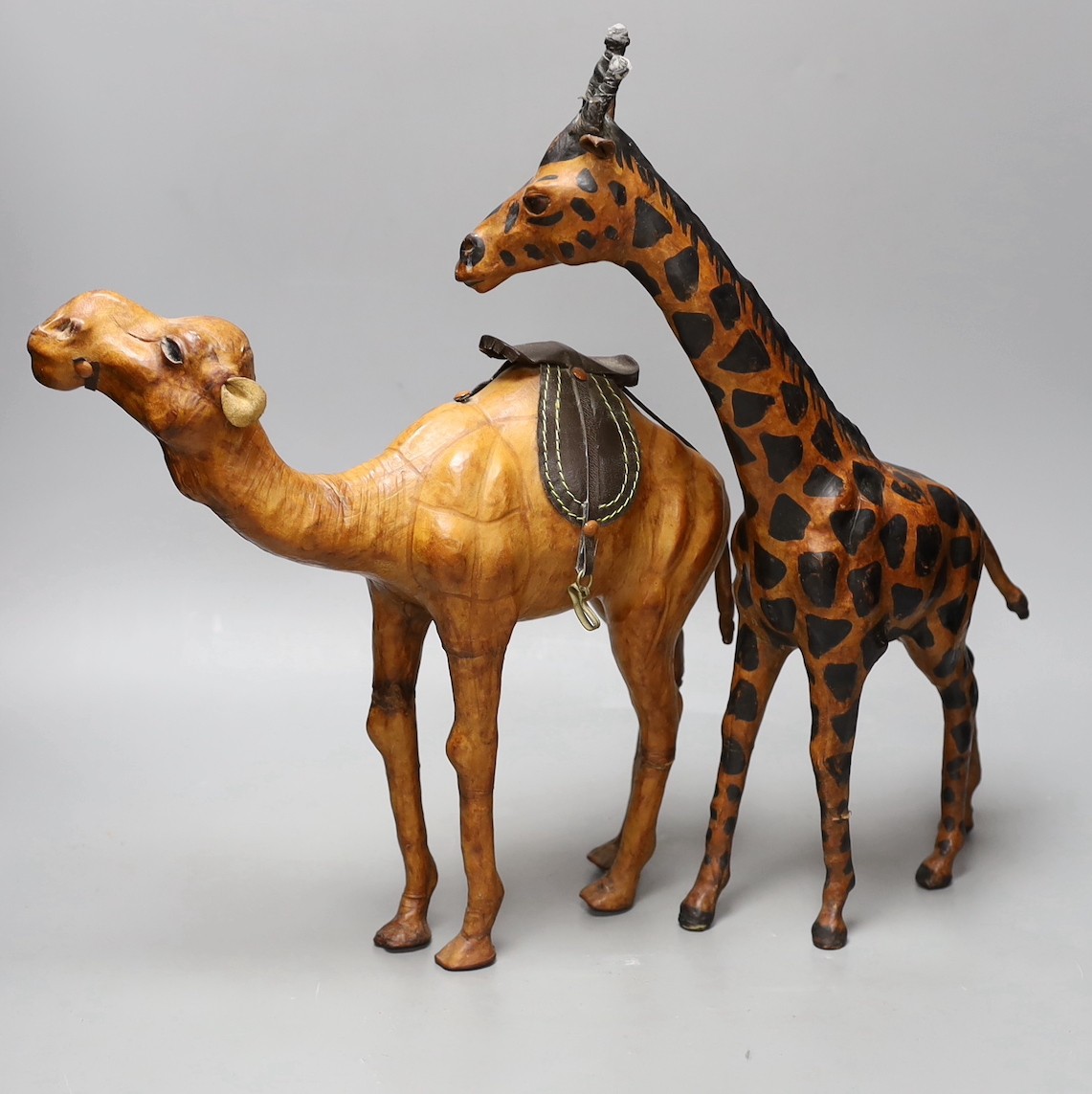 A Liberty style hide covered giraffe and camel (2) tallest 42cm